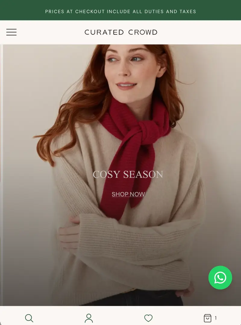 Curated Crowd storefront on a phone, with a banner stating prices at checkout include all duties and taxes and a Cosy Season collection hero